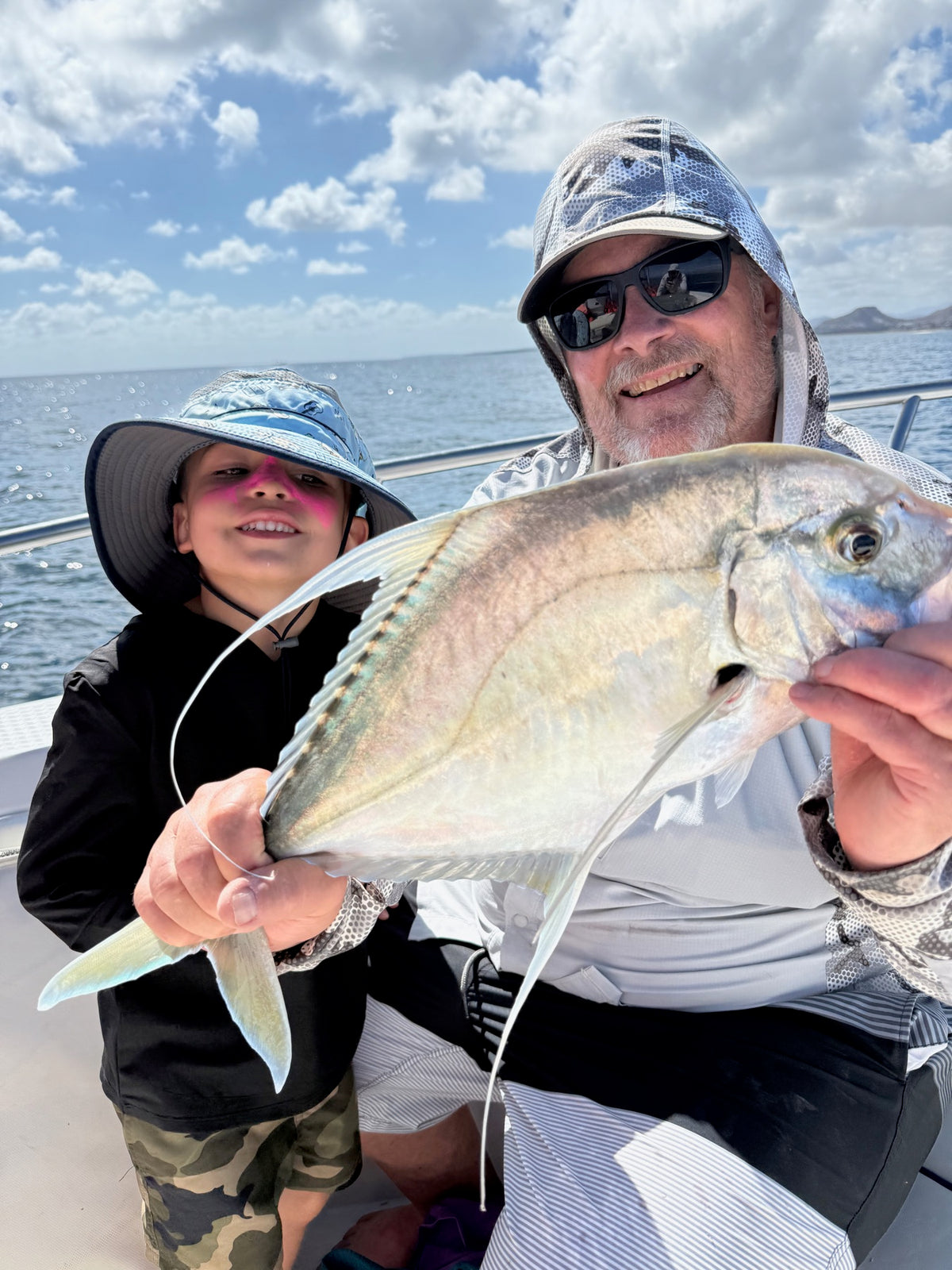 A digital fishing photo of an angler presenting the catch